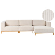 Divano angolare in velluto a 5 posti con braccioli e gambe in legno beige chiaro in stile moderno