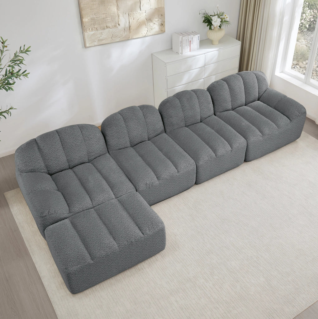 Divano modulare 4 posti con ottomana 366x165x79 cm in fleece granulato grigio