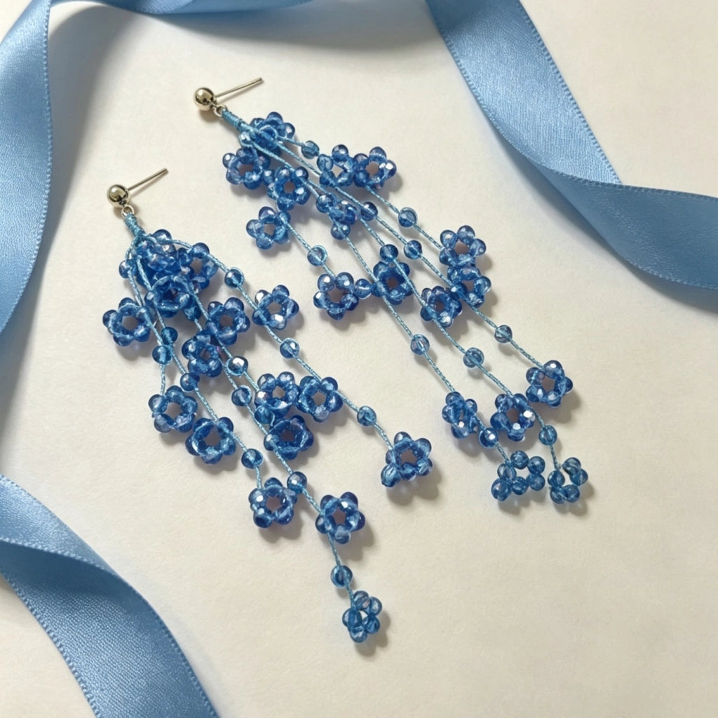 Orecchini a nappa con fiore in cristallo blu