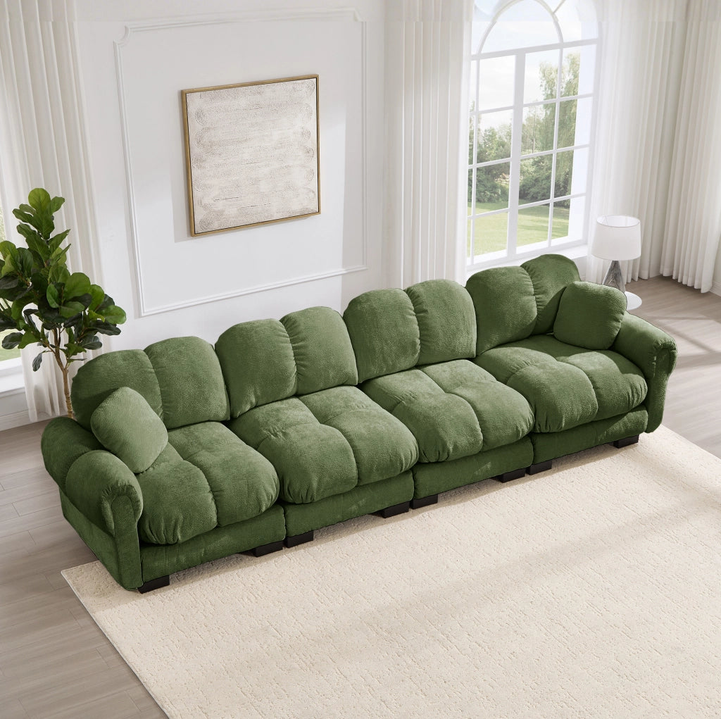 Divano modulare in chenille verde con braccioli curvi e cuscini trapuntati 330x86x90 cm