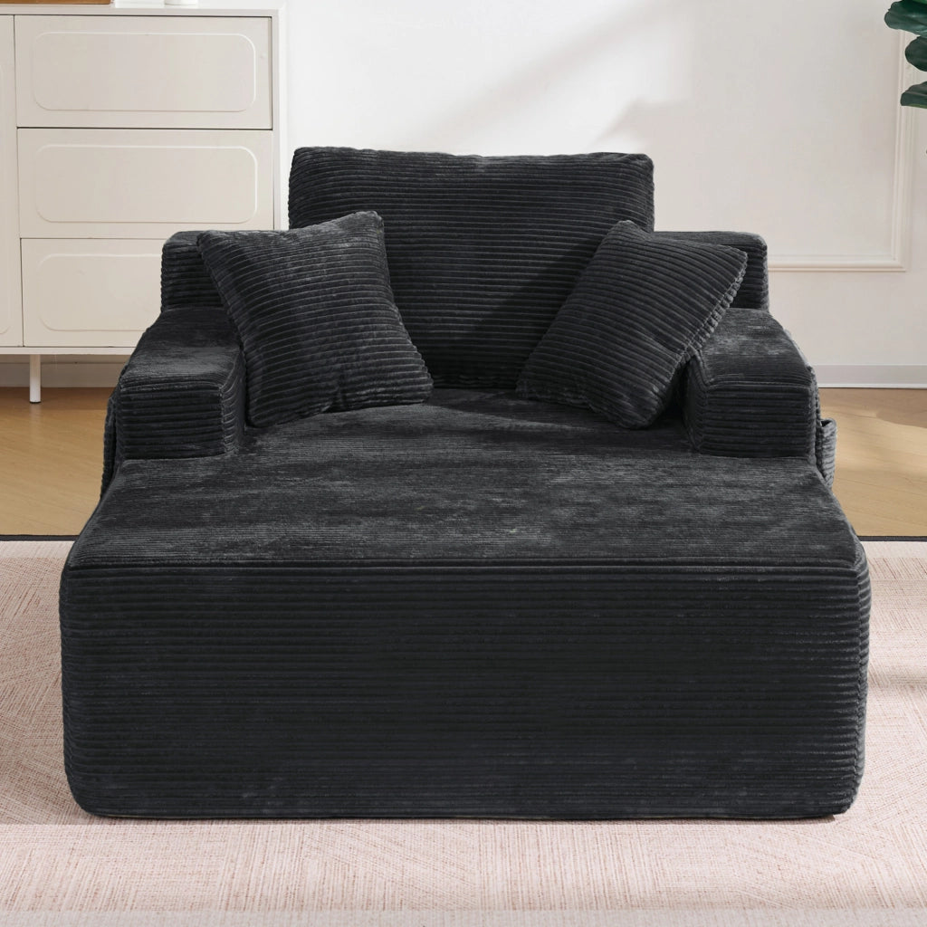 Divano compatto in corduroy nero con tasche laterali e cuscini; stile retr貌