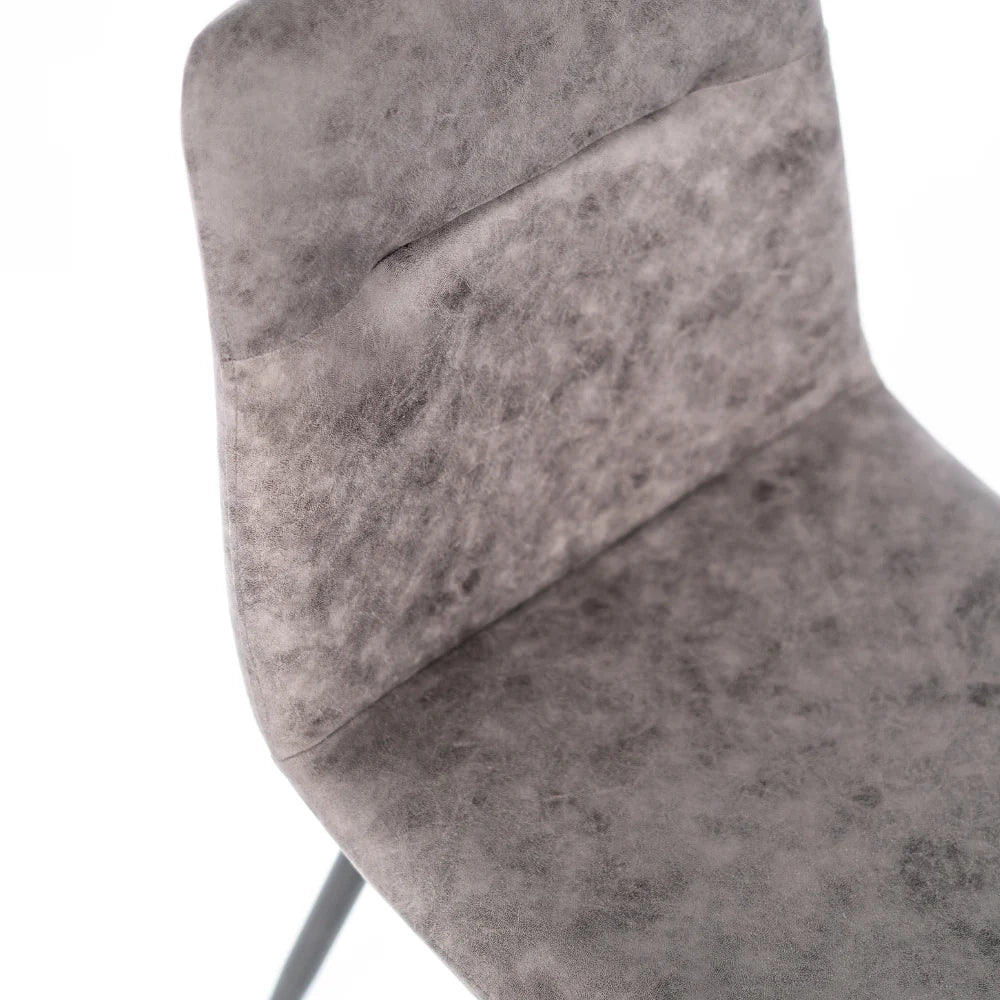 Set di 4 sedie da pranzo imbottite in similpelle grigio vintage Tia con struttura in metallo facili da pulire | Duzzle