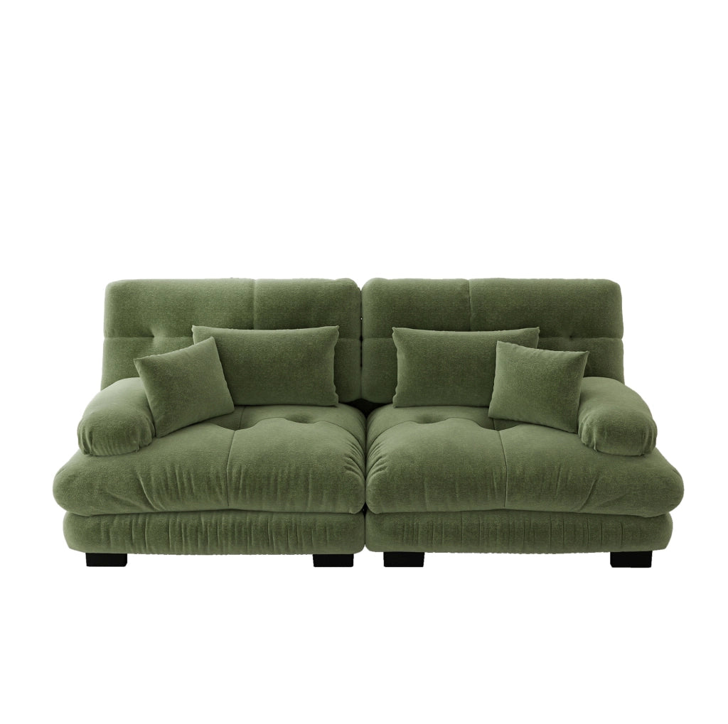 Divano modulare in chenille verde; seduta profonda e cuscini lombari