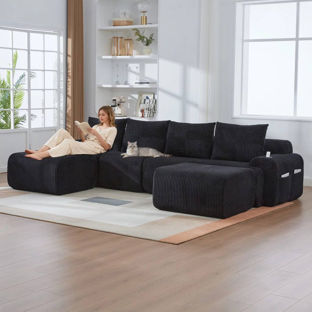 Divano modulare 4 posti in corduroy nero; con portabicchiere e tasca laterale; 333 x 174 x 80 cm