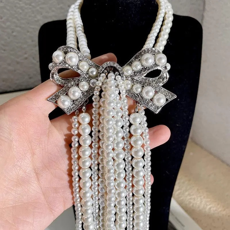Collana con fiocco doppio strato e nappa di perle, realizzata a mano, regalo di Natale o di compleanno.