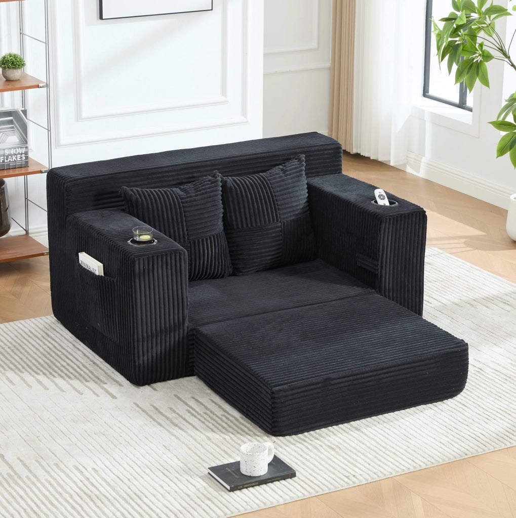 Divano pouf in velluto a coste nero 151x133 cm con tasche laterali e 2 cuscini HOMVRA