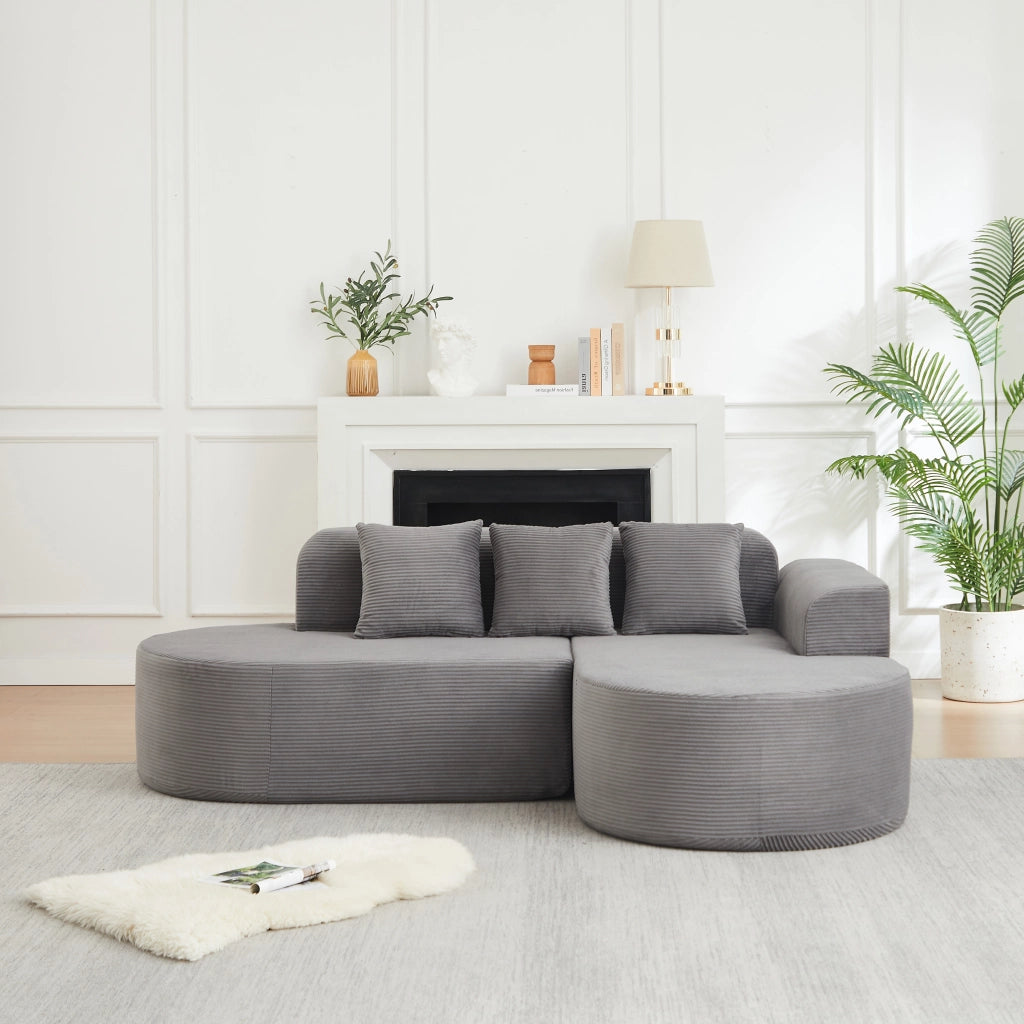 Divano modulare a L con linee curve 220x155 cm in velluto a coste grigio