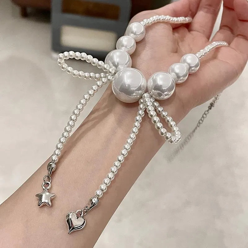 Collana con fiocco grande e perle, realizzata a mano, regalo di Natale o di compleanno.