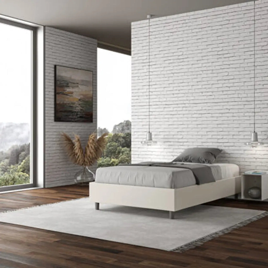 Letto una piazza e mezza contenitore imbottito 120x190 similpelle bianco Azelia