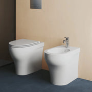 Coppia Di Sanitari Azzurra Ceramica Da Terra Filo Muro Senza Brida Bianco Lucido "Pratica"
