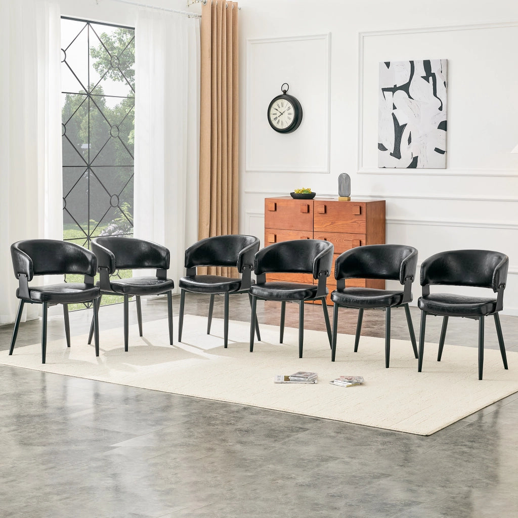 Sedie da pranzo in PU nero, design moderno con schienale sagomato e gambe in metallo