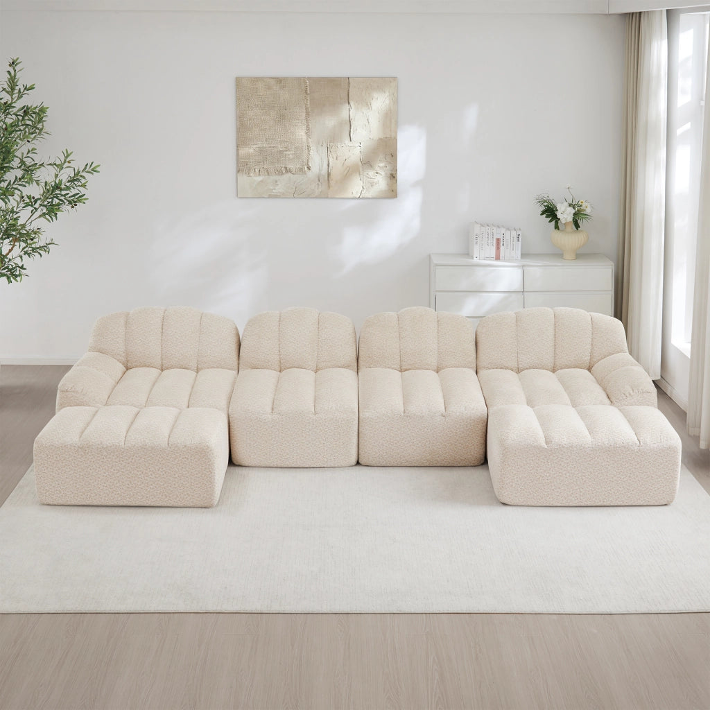 Divano modulare angolare 4 posti con ottomano; seduta profonda; in pile granulato beige bianco