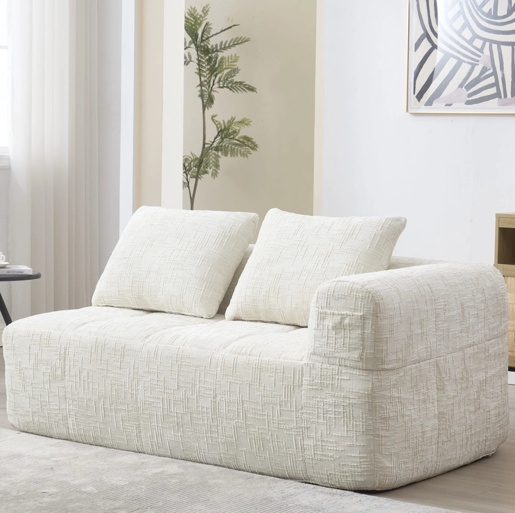 Divano chaise longue in ciniglia beige con tasche laterali
