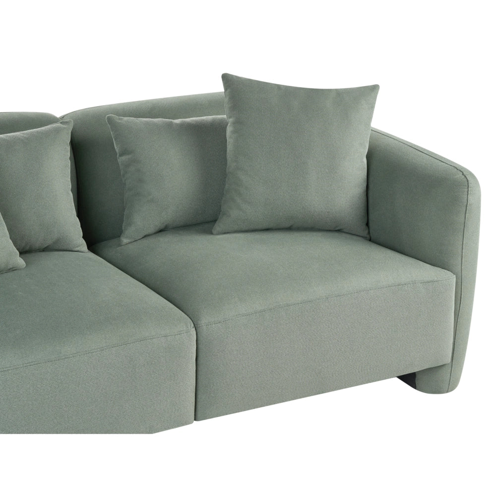 Divano imbottito minimalista a profilo ribassato a 3 posti con seduta profonda verde chiaro stile minimalista