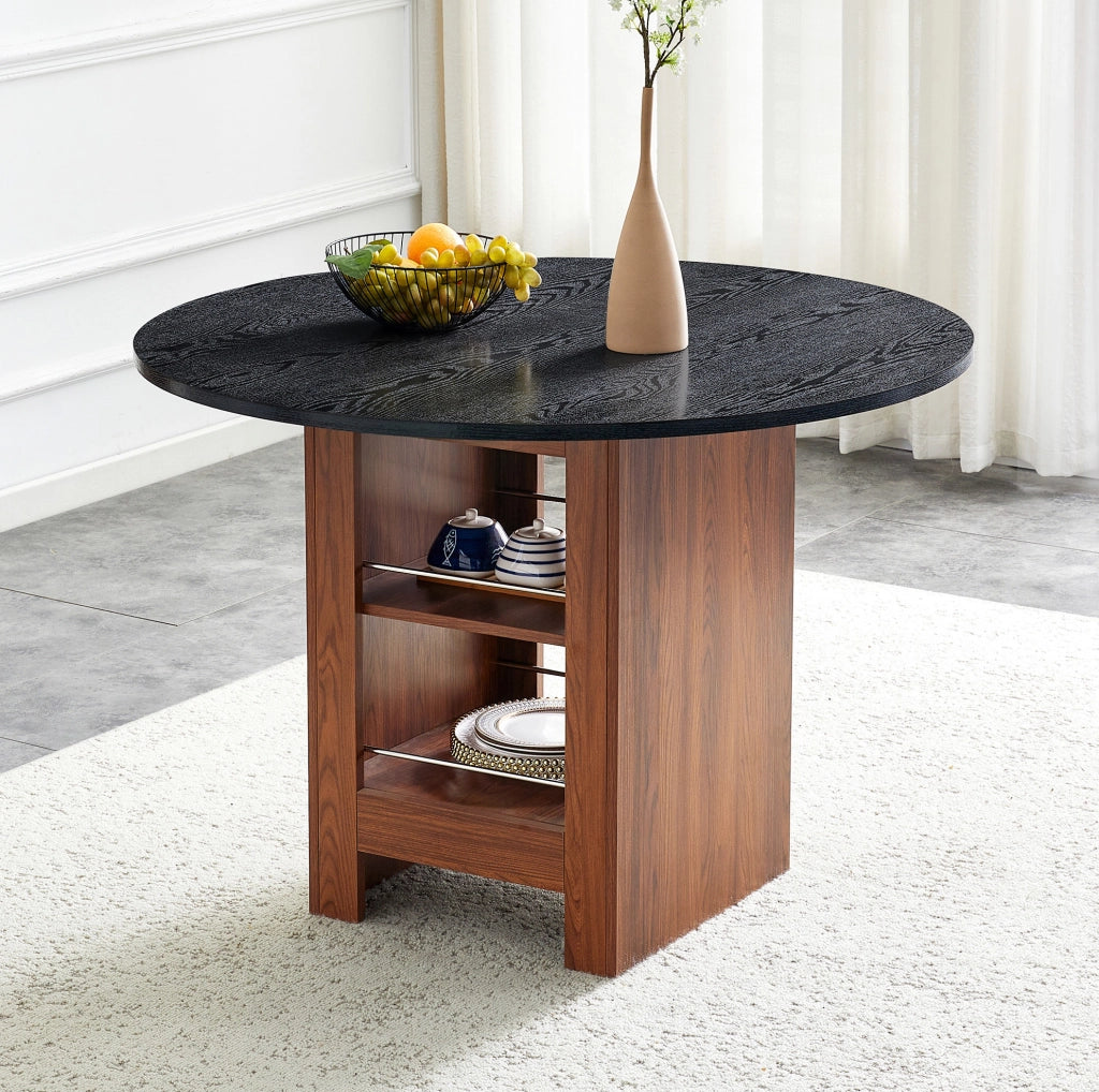 Tavolo da pranzo rotondo 100 cm con vani contenitore; effetto noce e nero; in MDF