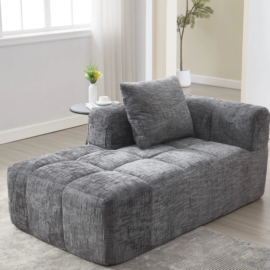 Divano chaise longue in ciniglia grigio con cuscino e tasche laterali per relax confortevole