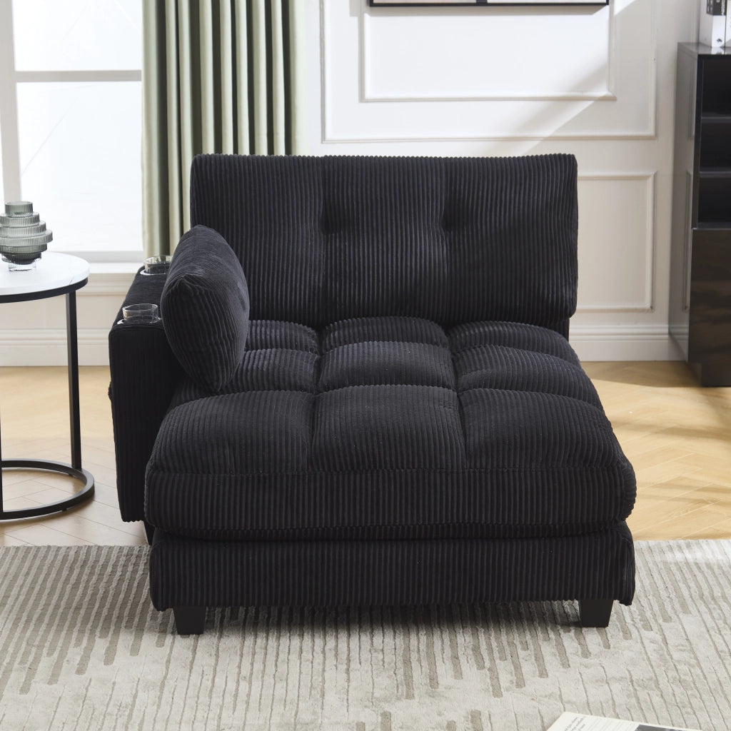Poltrona lounge moderna in corduroy nero con porta bicchieri, tasche laterali e porte USB