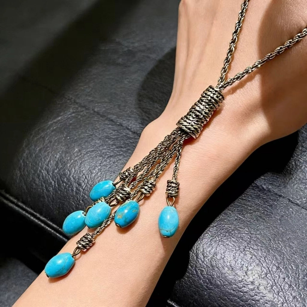 Collana con ciondolo a goccia in turchese naturale e nappa
