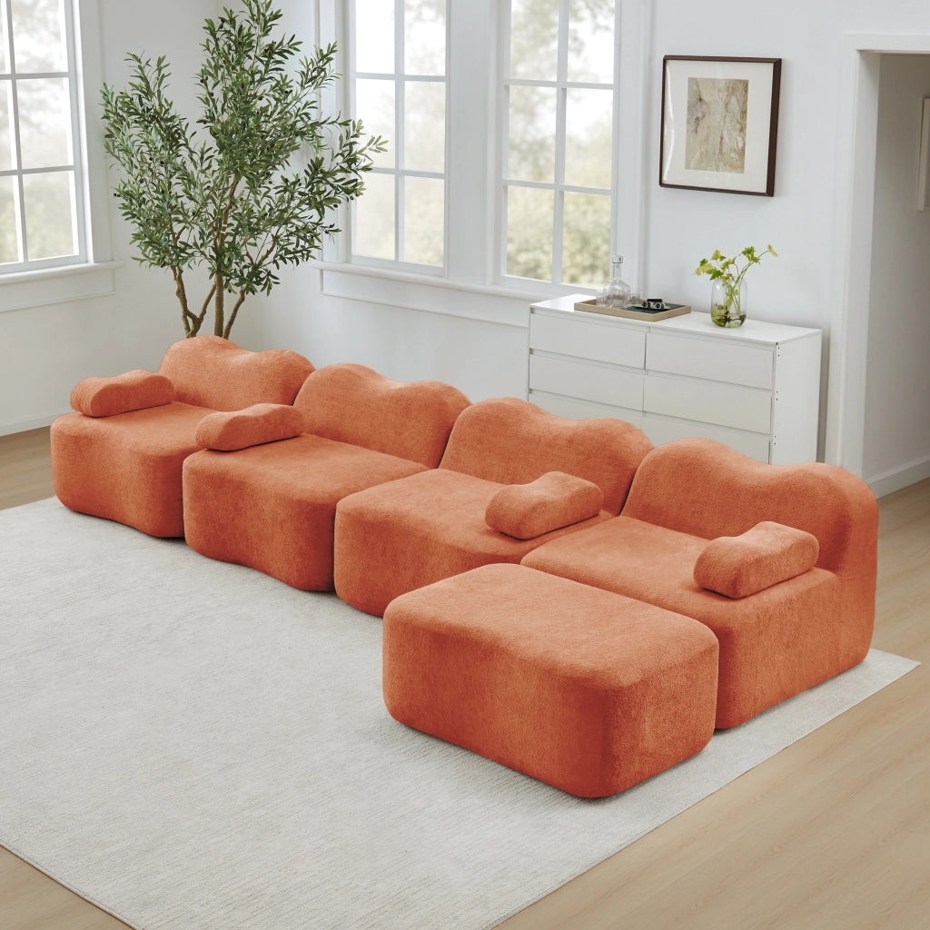 Divano angolare modulare a 4 posti senza struttura con pouf, bracciolo mobile e seduta profonda in velluto arancione