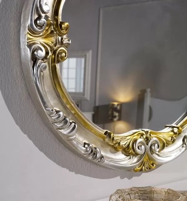 Specchiera in foglia argento ovale con particolari mecca- misure: 84 x 104 x 5