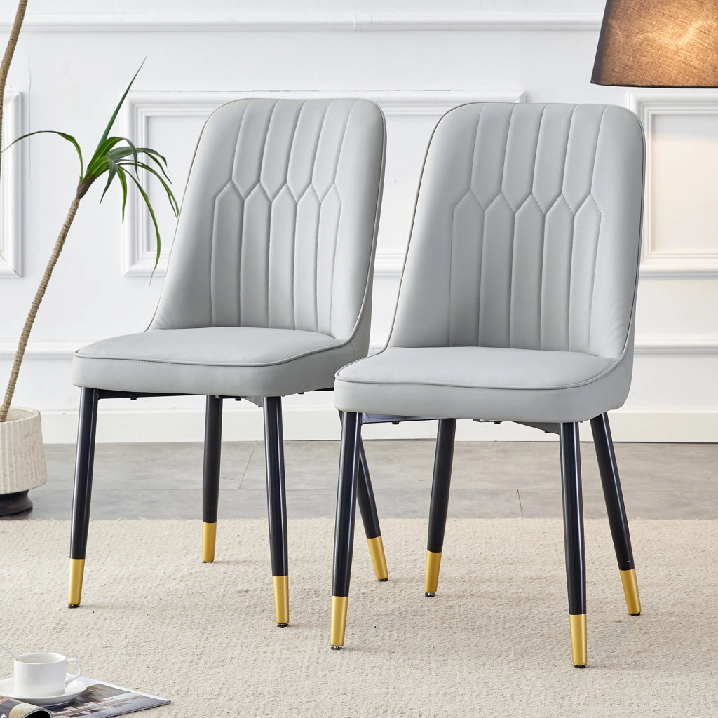 Chaise da pranzo in pelle pu con schienale ergonomico e seduta imbottita, gambe metalliche nere, grigio chiaro