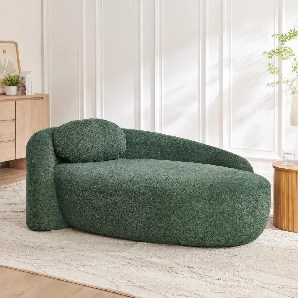 Divano lineare compatto con cuscino poggiatesta e design arrotondato in teddy verde