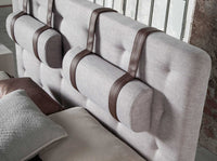 Letto grigio in tessuto trapuntato