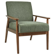 Poltrona da salotto con rivestimento in tessuto boucle verde scuro con struttura in legno stile retrò