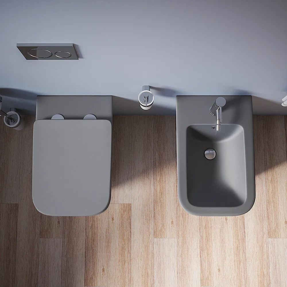 Coppia sanitari in ceramica filomuro vaso rimless, bidet e copri-wc grigio opaco | Kyoto