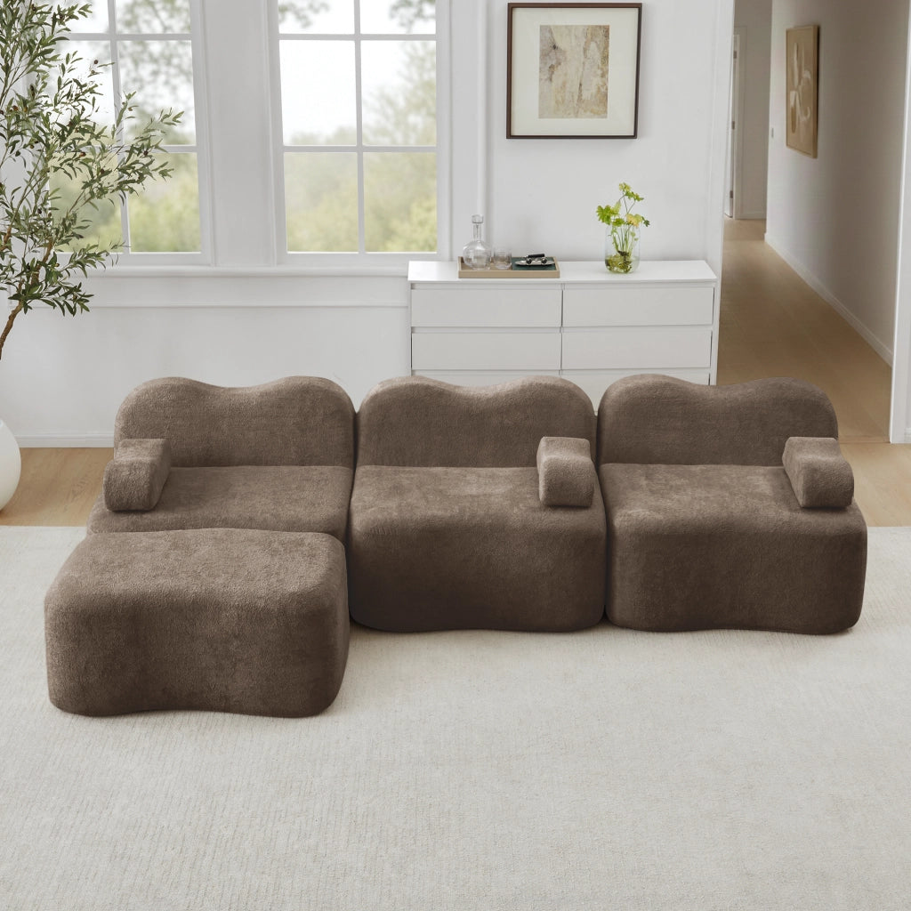 Divano angolare modulare senza struttura con pouf e seduta profonda, braccioli ergonomici in velluto marrone