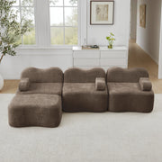 Divano angolare modulare senza struttura con pouf e seduta profonda, braccioli ergonomici in velluto marrone