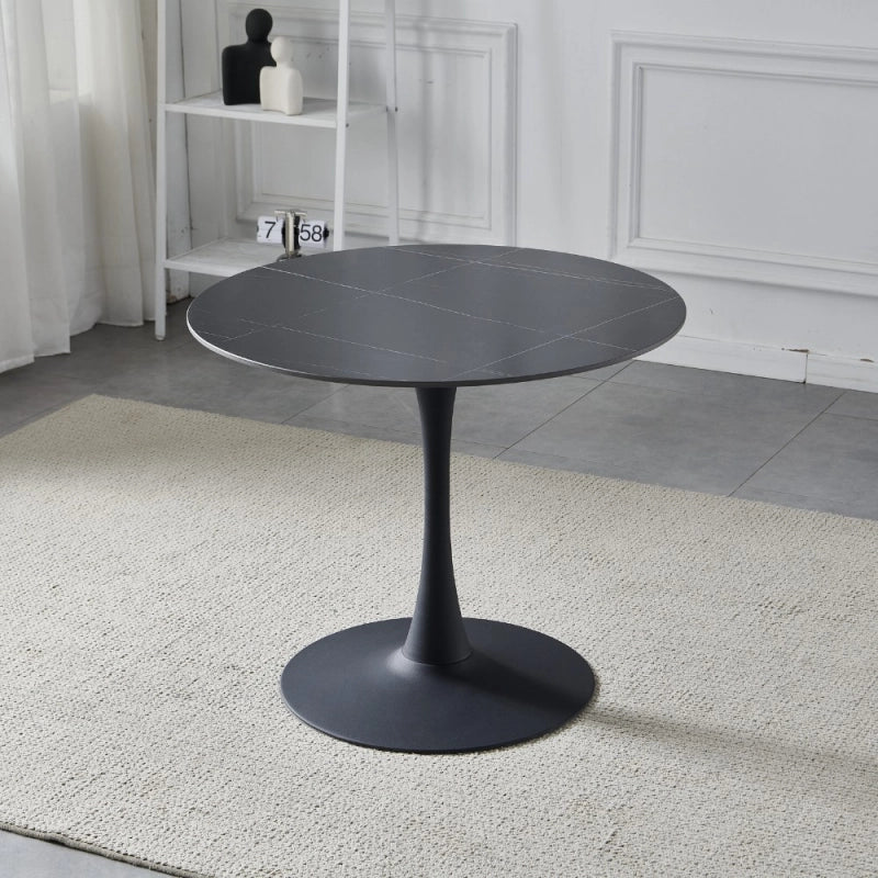 Tavolo rotondo Dot con piano in ceramica effetto marmo nero opaco con particolari oro e gamba nera