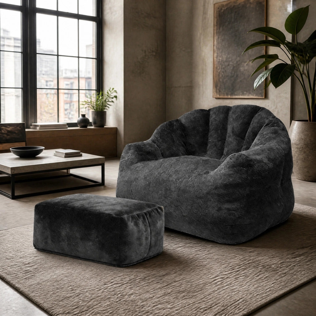 Poltrona relax con pouf abbinato in flannelette nera, design a petalo