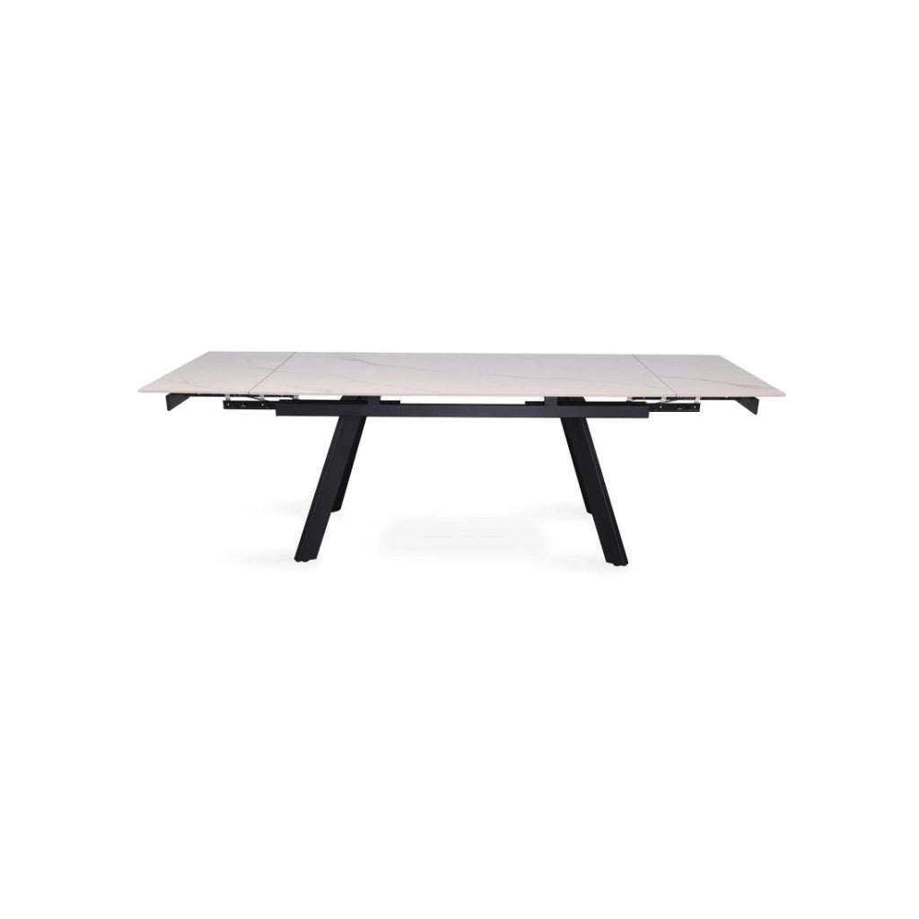 Tavolo da pranzo allungabile per 10 persone con piano in pietra bianca, collezione LAROS. Struttura in metallo.