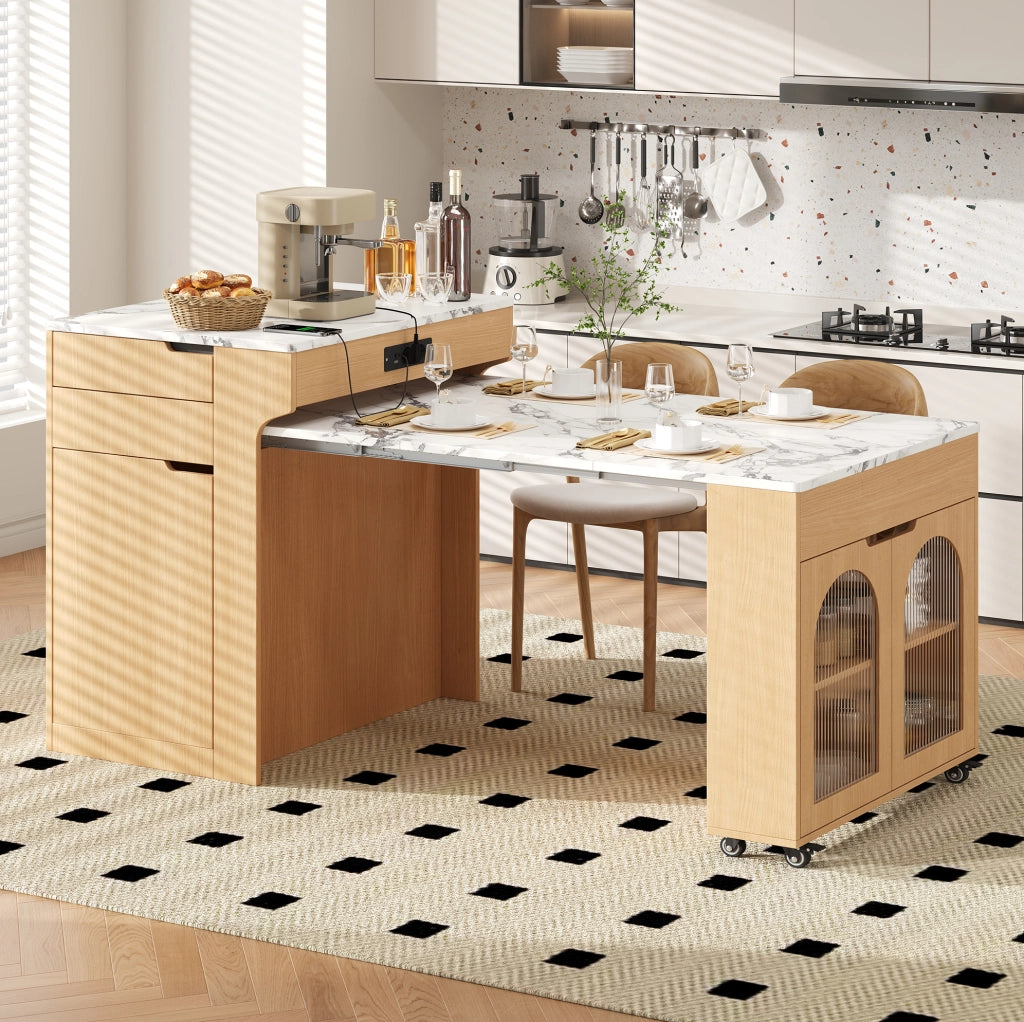 Isola cucina con tavolo estraibile, prese e cassetti