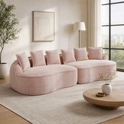 Divano modulare senza struttura in tessuto chenille rosa; con chaise longue profonda e cuscini