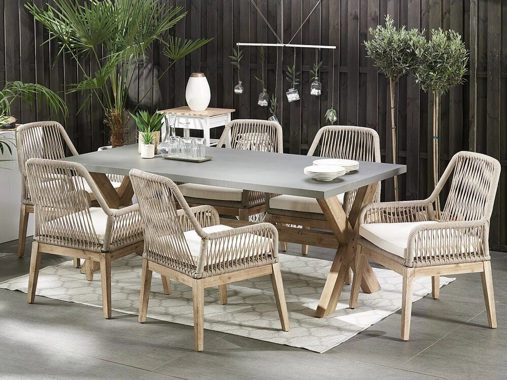 Set da pranzo da giardino Tavolo in cemento grigio e beige 6 sedie in propilene di vimini beige dal design moderno