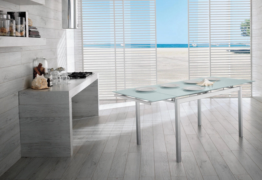 Tavolo Allungabile Baud con Top in Vetro Temperato Bianco e Gambe in Metallo Verniciato - Design Moderno 130/200cm per 8 Persone