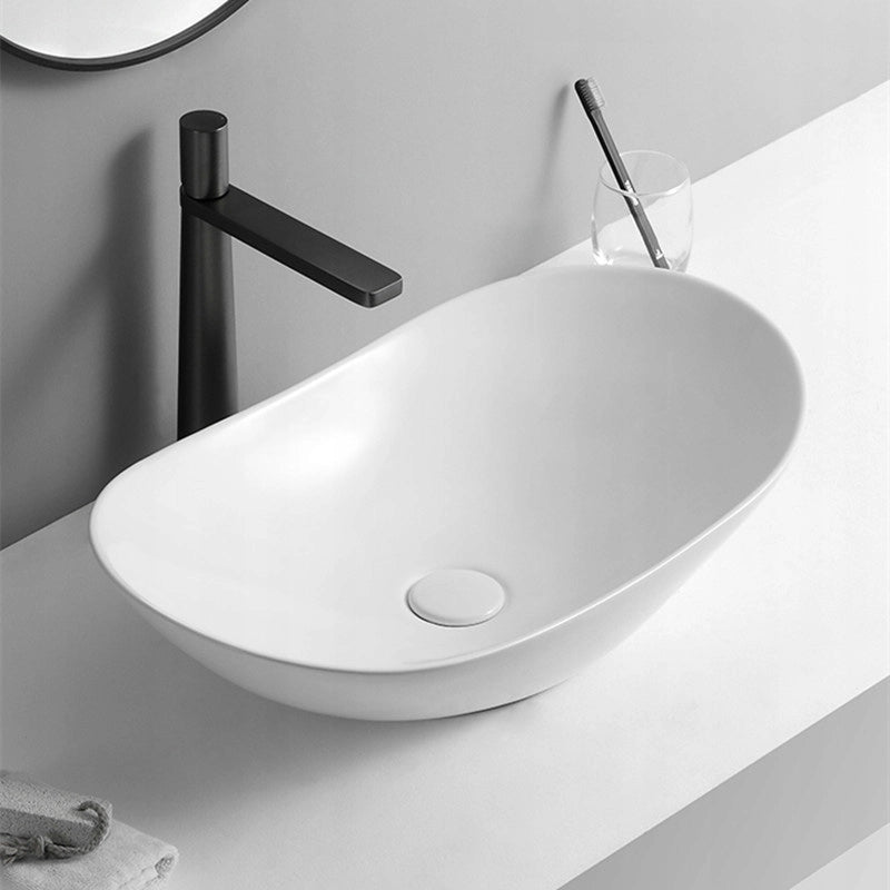 Lavabo ovale da appoggio in ceramica bianca