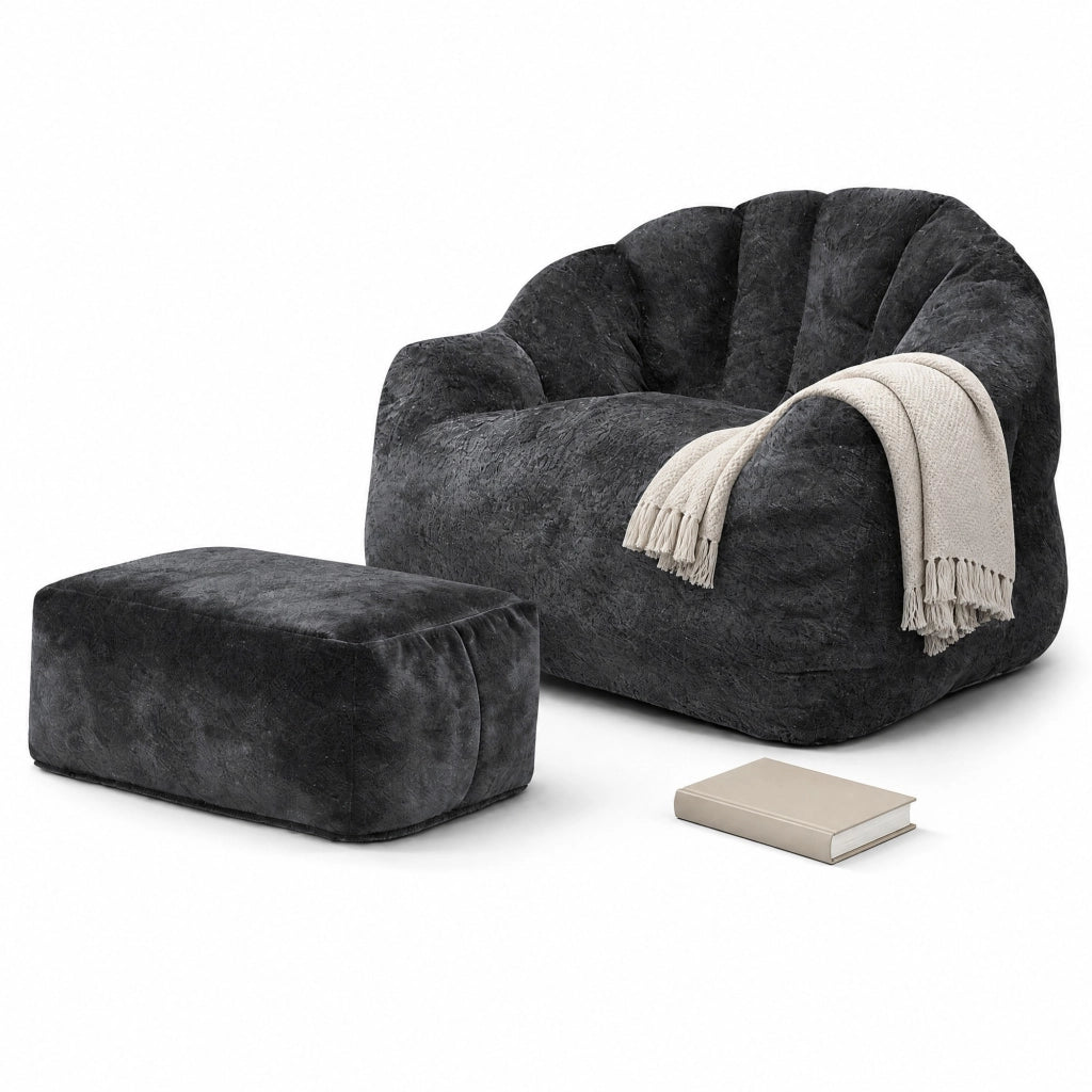 Poltrona relax con pouf abbinato in flannelette nera, design a petalo