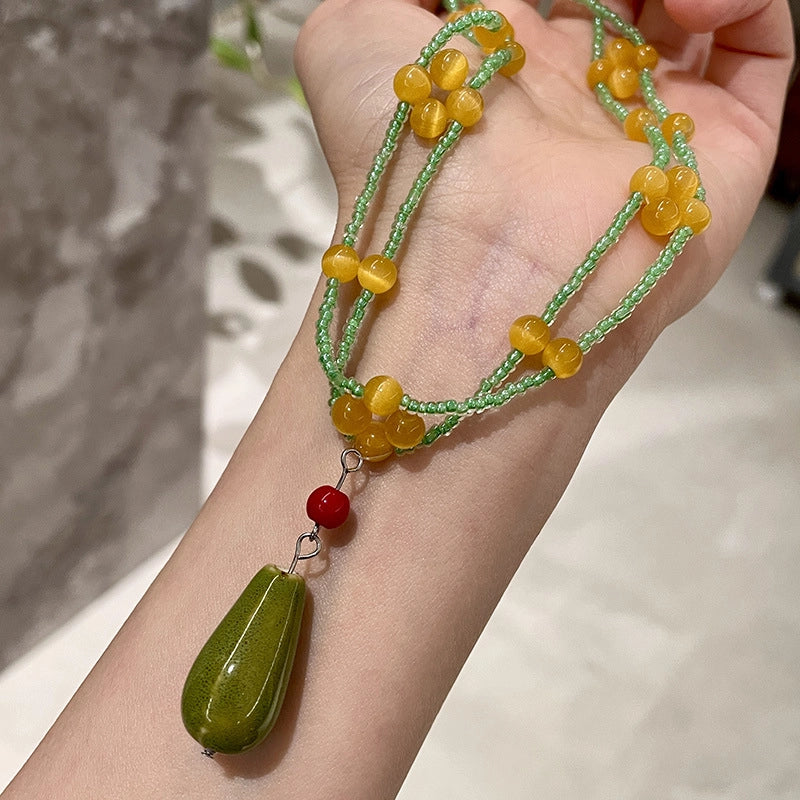 Collana vintage con perline a goccia in ceramica verde