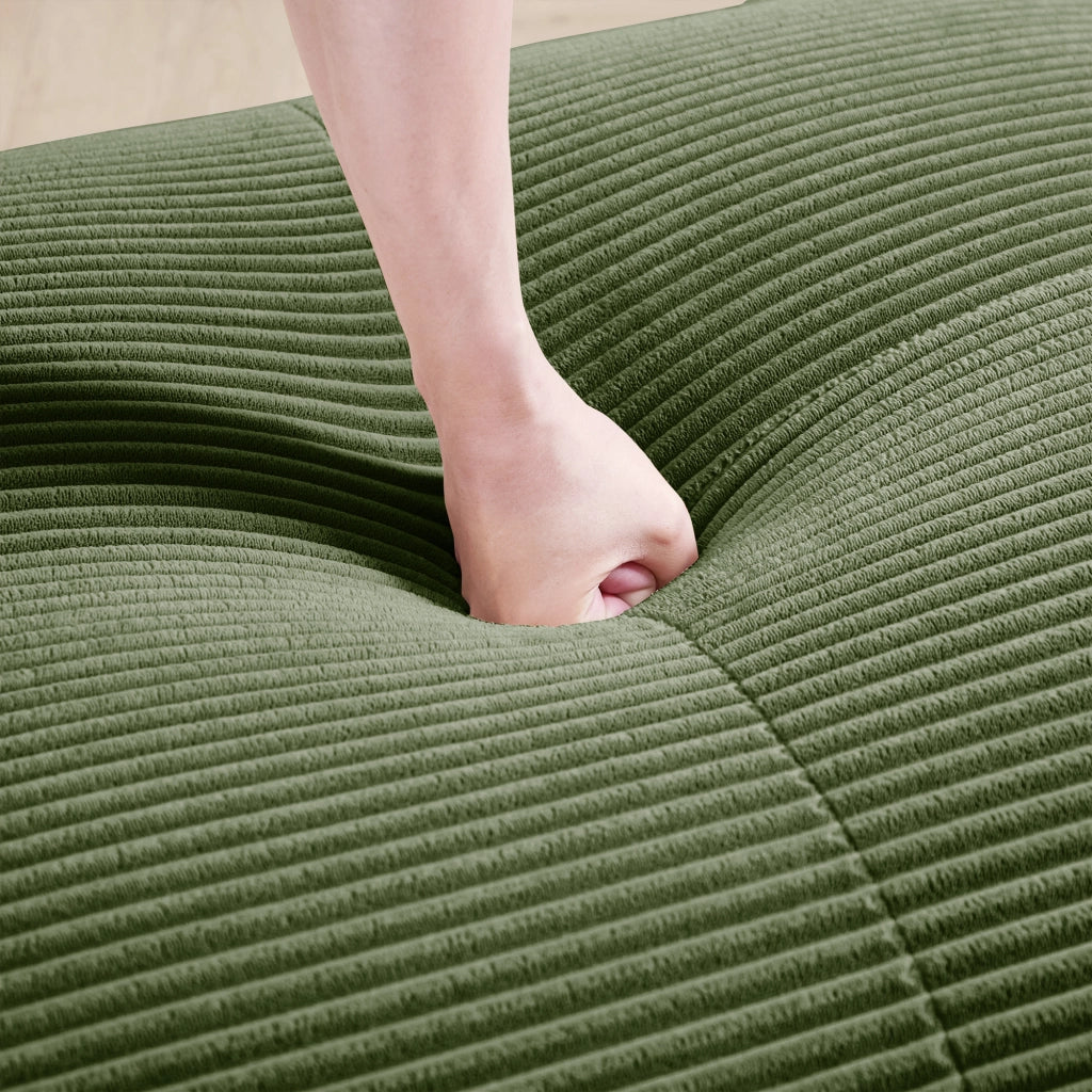 Divano angolare modulare senza struttura in tessuto a coste con braccioli ergonomici e base antiscivolo verde