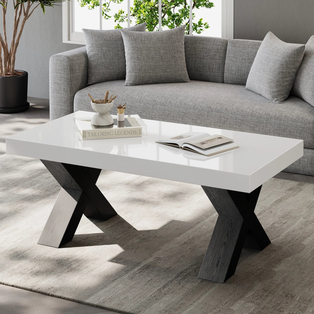 Tavolino da caffè 100x50x40 cm con piano lucido e gambe a X in MDF bianco e nero