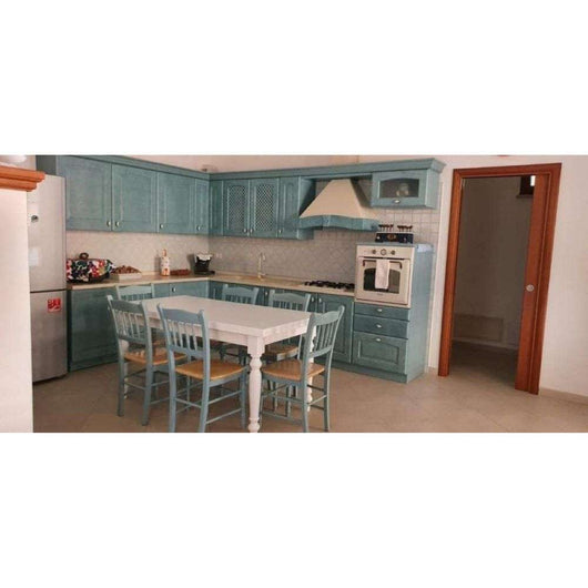 Tavolo da pranzo con apertura a libro fino 200 cm e gmabe tornite in legno massello e mdf con rifinitura in bianco 100x100x75 H chiuso