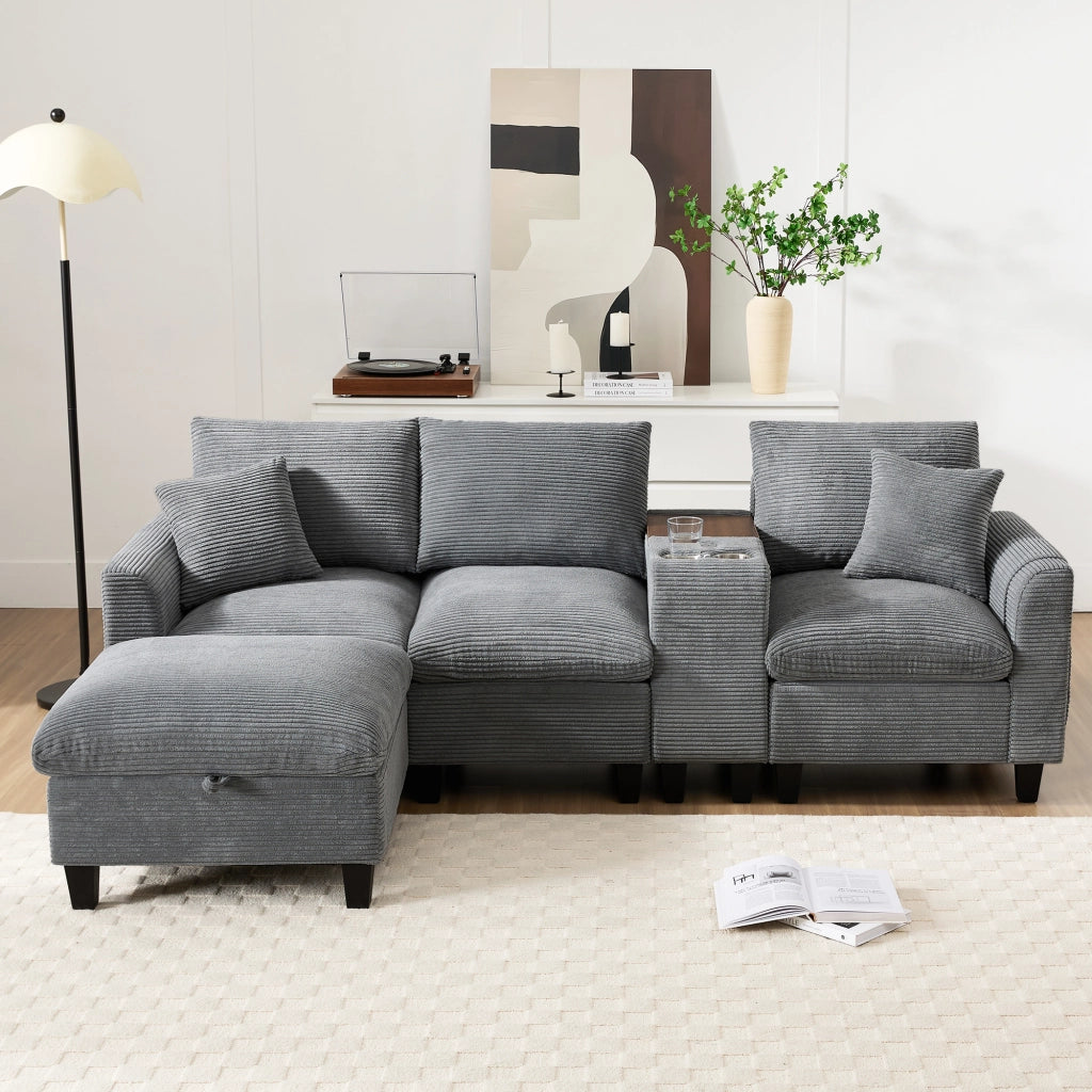Divano angolare modulare in corduroy con consolle centrale porte USB portabicchieri e cuscini grigio per soggiorno