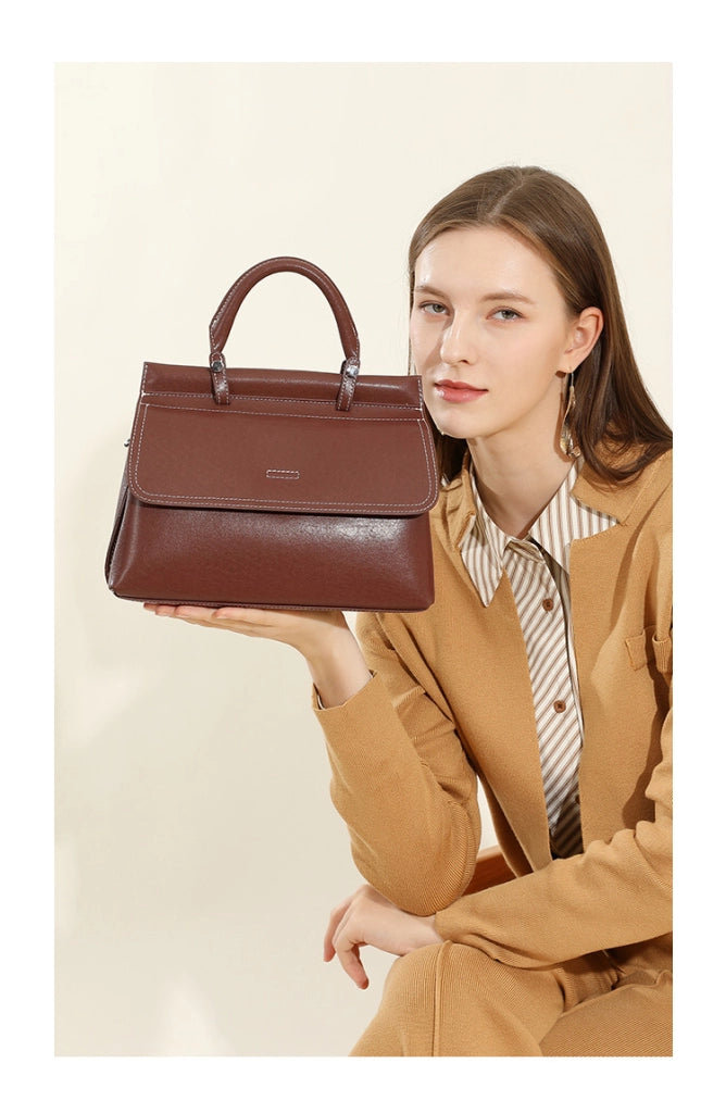 Borsa a mano da donna in vera pelle, colore marrone.