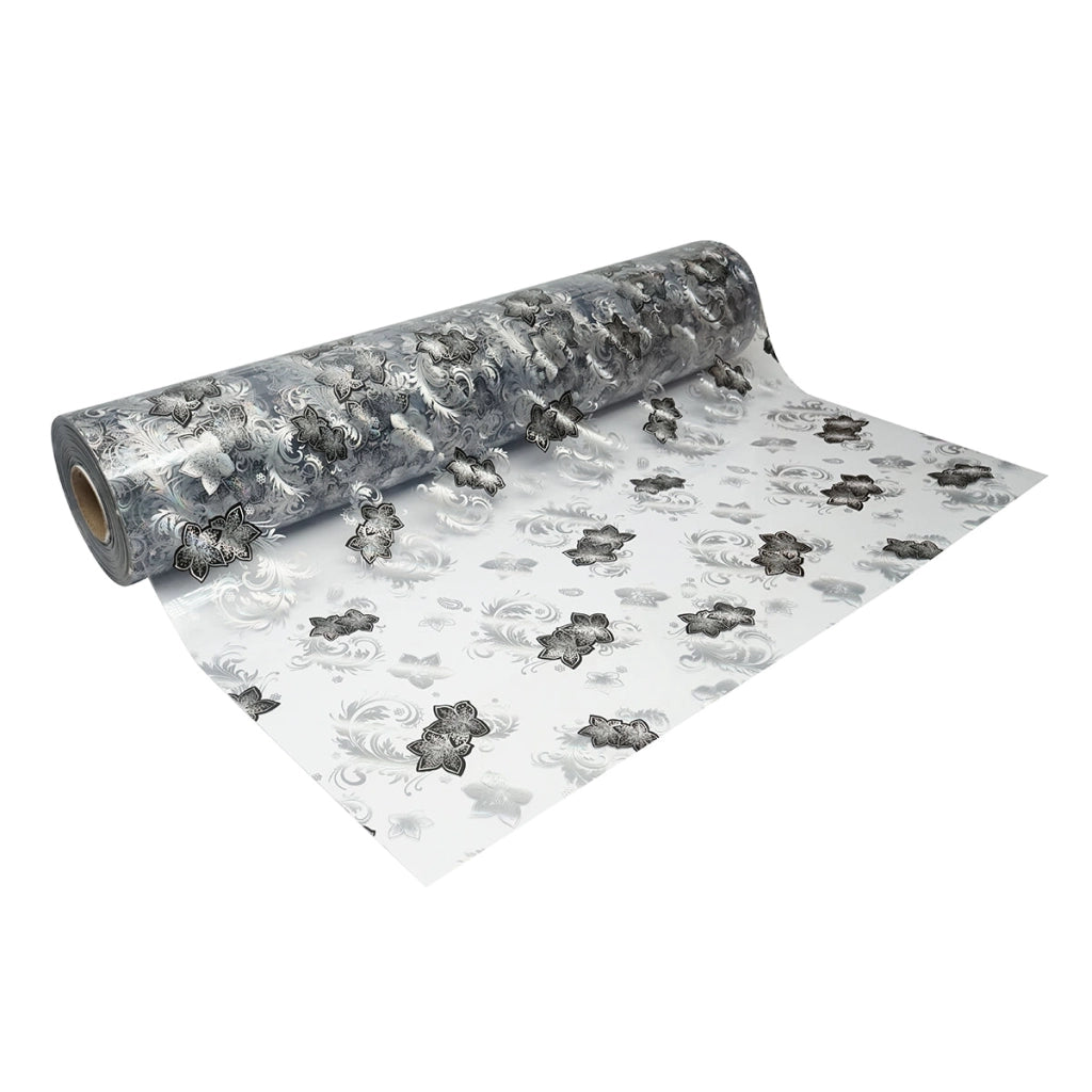 Rotolo pellicola protettiva per tavolo in PVC siliconato trasparente – modello floreale nero Materiale: PVC siliconato trasparente  Dimensioni rotolo: 1,00 × 20 m Breckner Germany
