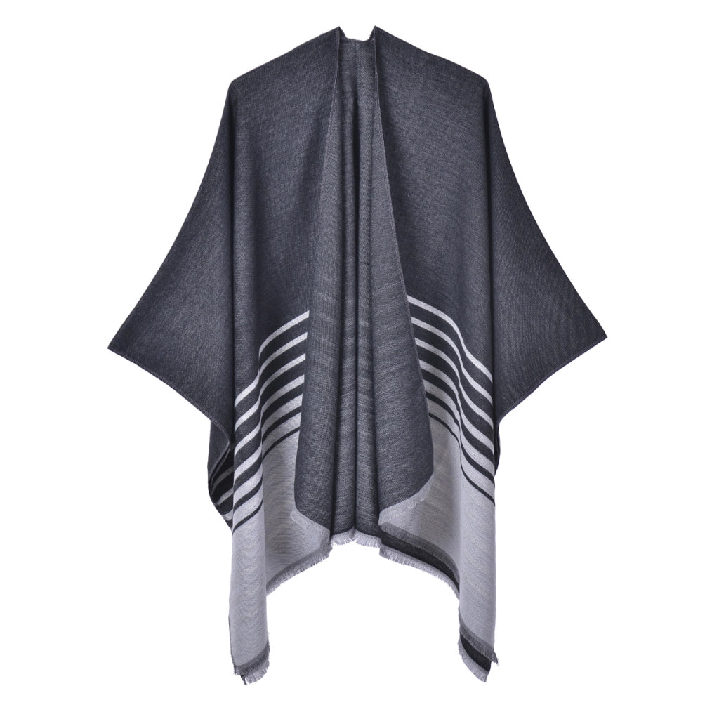 Mantella calda da donna reversibile in maglia con spacco e nappine.