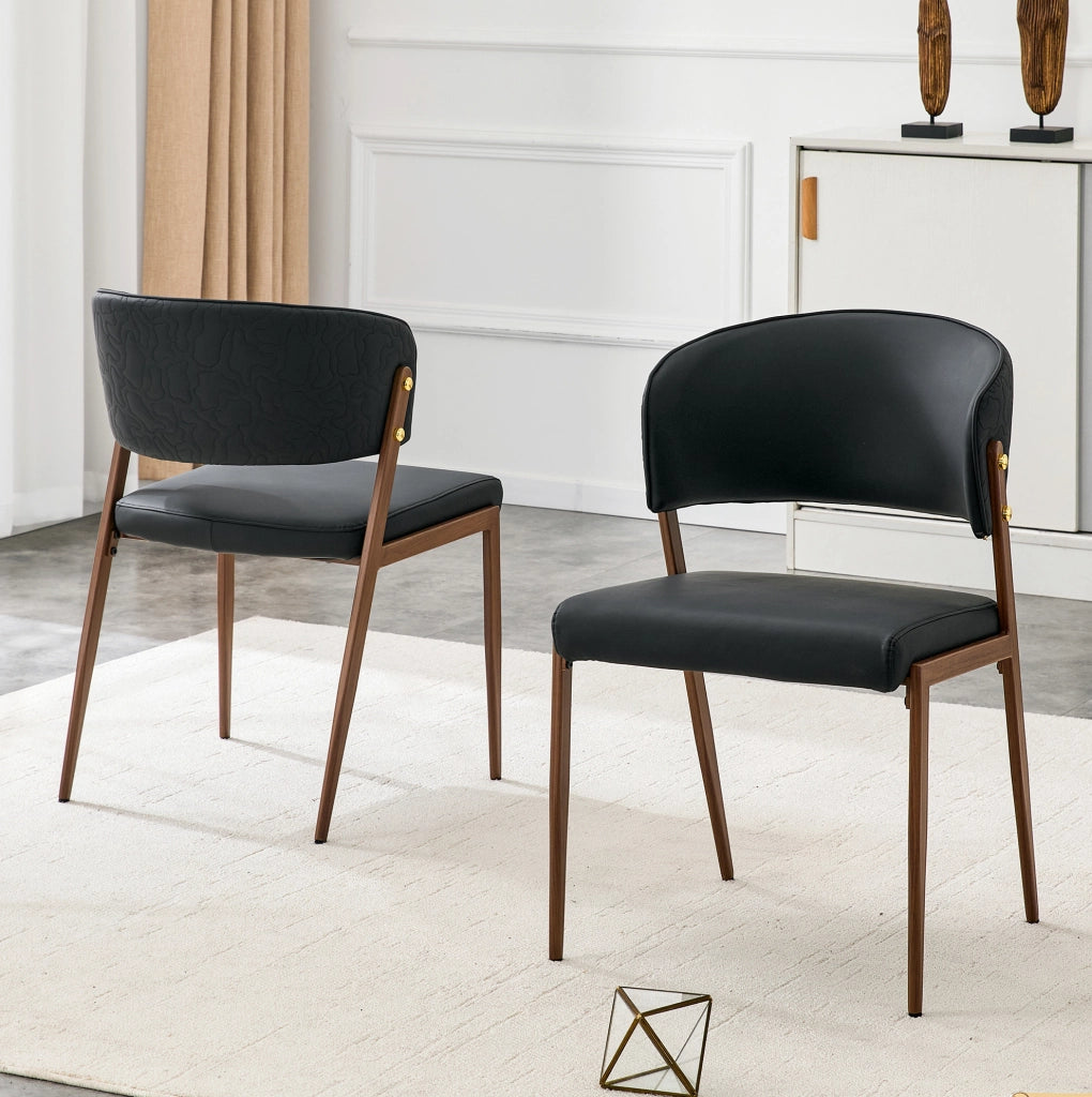 Sedia da pranzo moderna in ecopelle con schienale ergonomico e gambe in metallo nera