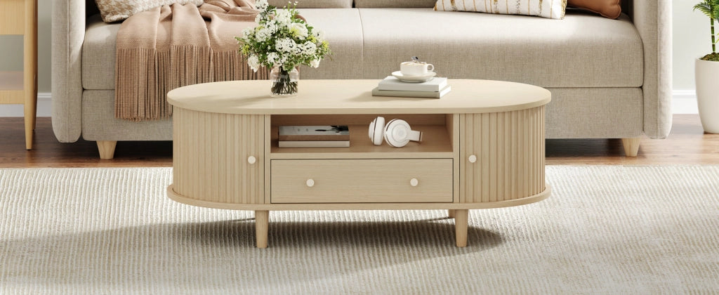 Tavolino basso ovale con 1 cassetto, vani aperti e anta scorrevole, per soggiorno, in MDF, rovere, 100 × 50 × 36 cm